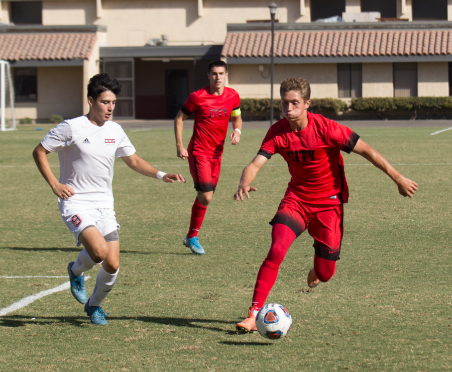 Freshman+forward%2C+Michael+Gonzalez%2C+presses+against+COS+in+a+Tuesday%2C+Oct.+29%2C+2019+match.+FCC+struggled+to+perform+mentally+and+physically%2C+says+coach+Eric+Solberg.