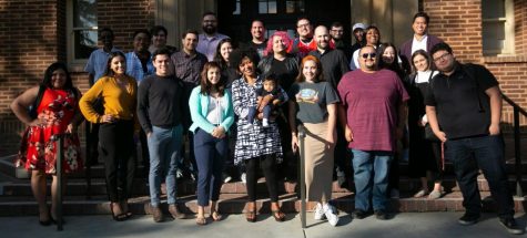 Journalism instructor Dympna Ugwu-Oju  poses with multiple generations of Rampage reporters on Wednesday, Nov. 6, 2019. Ugwu-Oju has advised the Rampage for over 10 years.