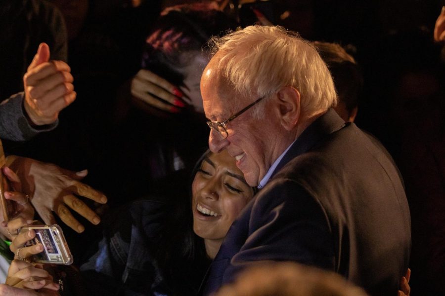 Presidential hopeful Sen. Bernie Sanders poses for a selfie with a supporter, Friday, Nov. 15, 2019. Sanders hosted a Green New Deal rally at Fresno City College. 