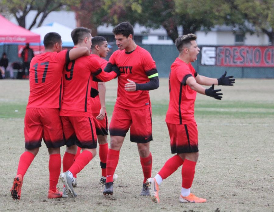 Mason Gonzalez celebrates with his fellow teammates after scoring the lone goal for the Rams during their 1-0 win over the San Joaquin Delta Mustangs on Saturday, Nov. 30. The goal propelled the Rams to the semifinals round for the 2019 CCCAA State Championship.