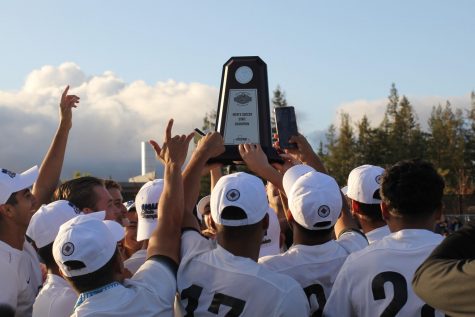 The FCC mens soccer team hoists the CCCAA Mens Soccer State Championship trophy following their 2-0 win in the finals over the Mt. San Antonio College Mounties on Sunday, Dec. 8, 2019.