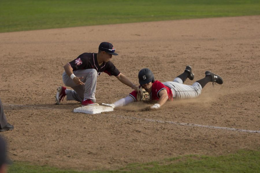 Freshman third baseman Evan Rocha tags the runner out to end the top of the sixth inning in the Rams 2-1 on Saturday, Jan. 25, 2020.