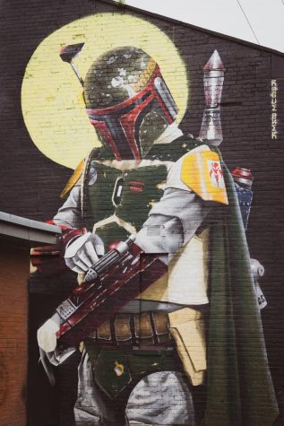 A mural of Boba Fett, a Mandalorian bounty hunter known from Star Wars. Other Mandalorians are the focus of a widely popular TV series on Disney +.