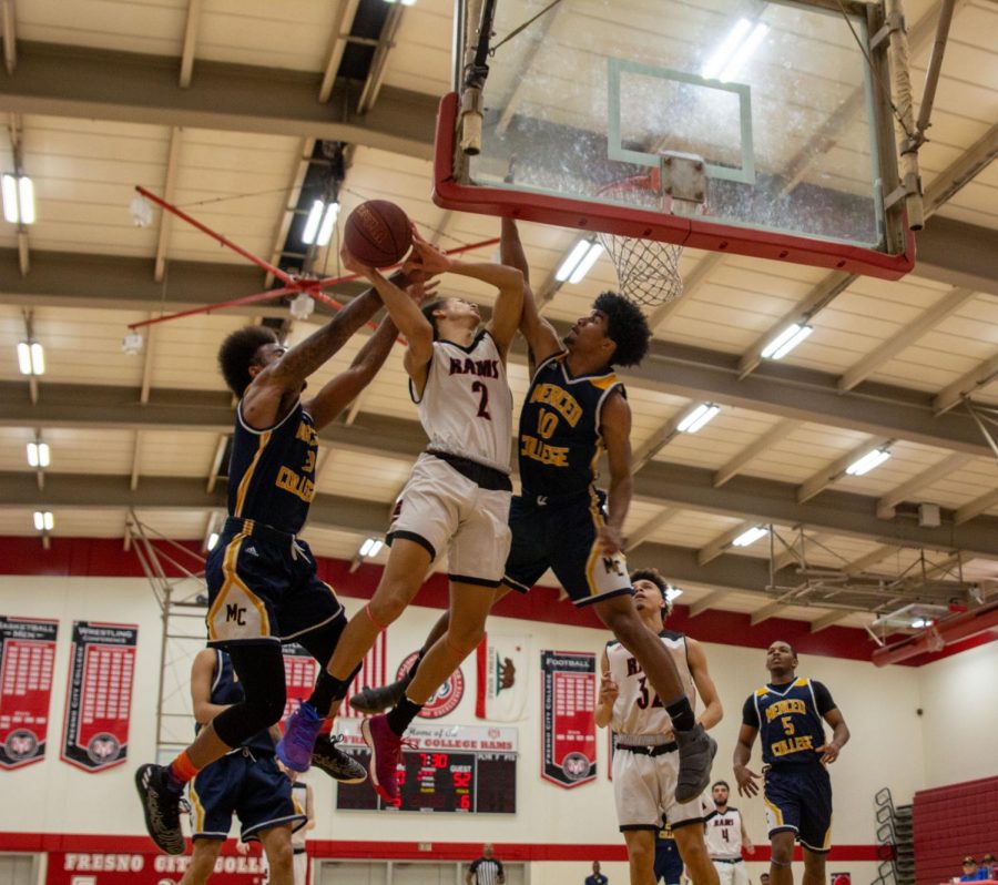 Freshman guard Marcus McCutchen fights through traffic on the way to the basket during the Rams regular season finale against the Merced College Blue Devils