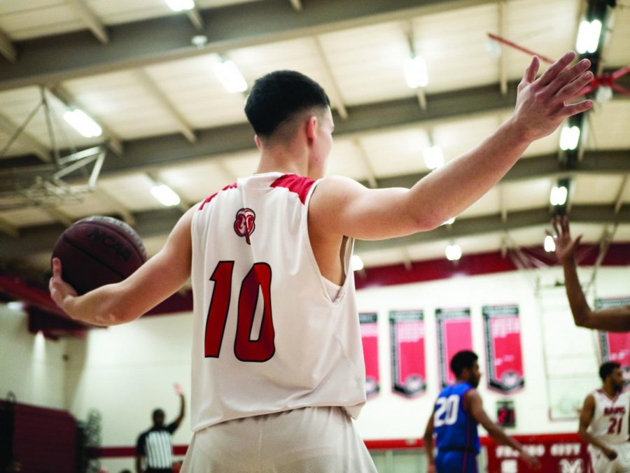 Sophomore+guard+Eljay+Gallegos+inbounds+the+ball+in+the+Rams+win+against+West+Hills+Coalinga+on+Saturday%2C+Feb.8%2C2020.+Gallegos+works+hard+to+create+his+opportunities+on+the+court+and+in+his+life.