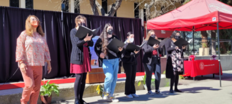 Julie Dana and her singers performing at the Womens Day event in the speech area of Fresno City College.