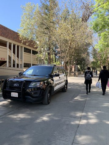 SCCCD police officers patrolling while students walk across Fresno City College campus. 