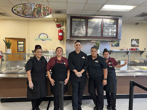 FCC food service director Carolyn Foust ,second from the right, and her staff inside the Fresno City Collage Cafeteria
