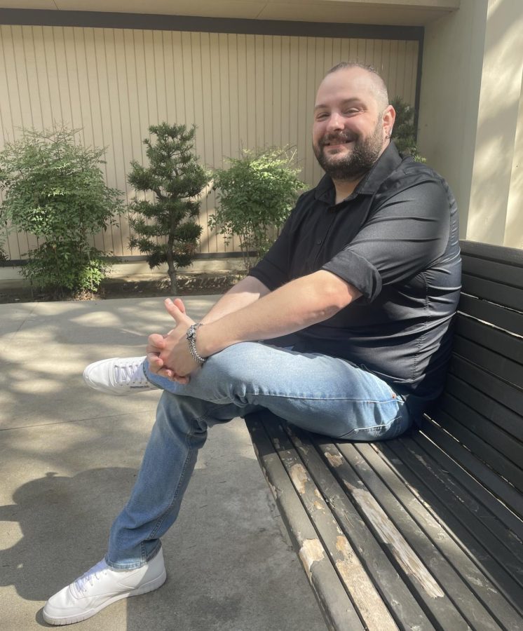 Dominick Callahan, a costume design major, sitting on campus at Fresno City College on  April 17.
