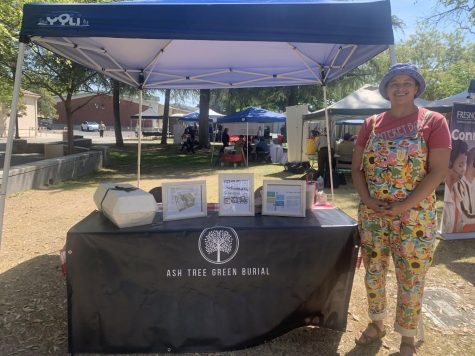 Cecily Callahan, stands in front of her exhibit Ash Tree Green Burial on April 22, 2023.