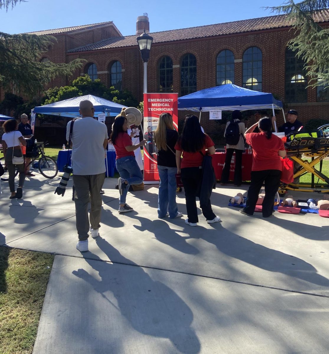 People checking out what the Emergency Medical Technician booth had at the event in front of the library on Sept. 27 at Fresno City College.
