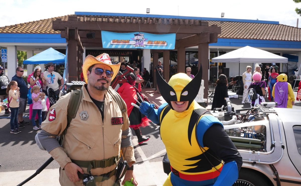 Ghostbusters+and+Wolverine+cosplay+pose+for+a+photograph+at+the+Heroes+Fest+on+Saturday+9%2F30.