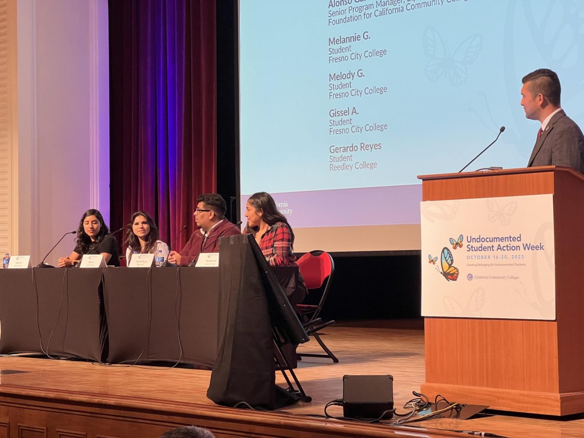 Alonso Garcia moderating the undocumented student panel during the Undocumented Student Action Week event at Fresno City College’s Old Administration Building Auditorium on Oct. 16, 2023.