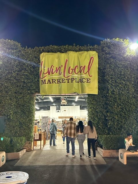 Customers walking in to the Livin Local Marketplace at the Big Fresno Fair on Oct. 12, 2023.