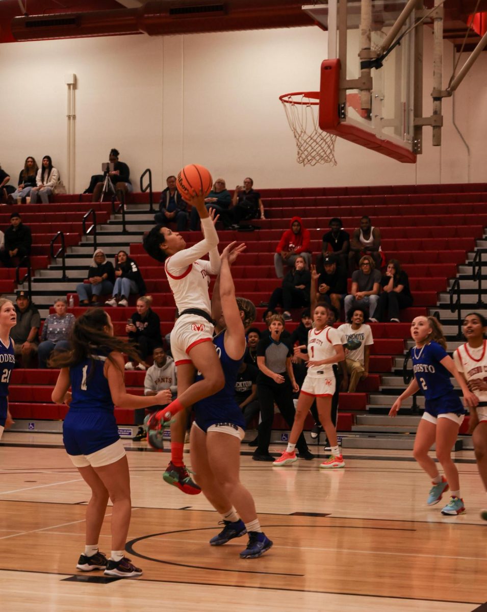 T’yanna Armstrong, No. 21, shoots a layup before halftime in the gym on Nov. 1.