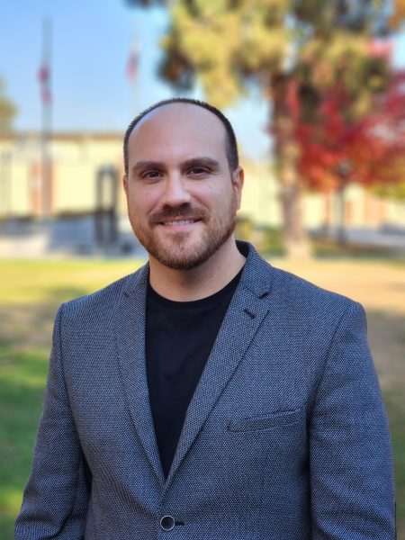 Dr. Samuel Montano poses for a portrait photo at Fresno City College in Veterans Square. December 5, 2023.