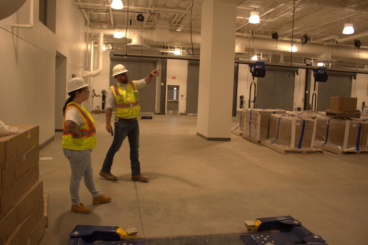 Project Supervisor Austin Nelson [right] giving a tour of the yet to be
finished Advanced Transportation Center at the West Fresno Center
to Rampage Entertainment Editor Samantha Washburn [left] on July
19, 2023.