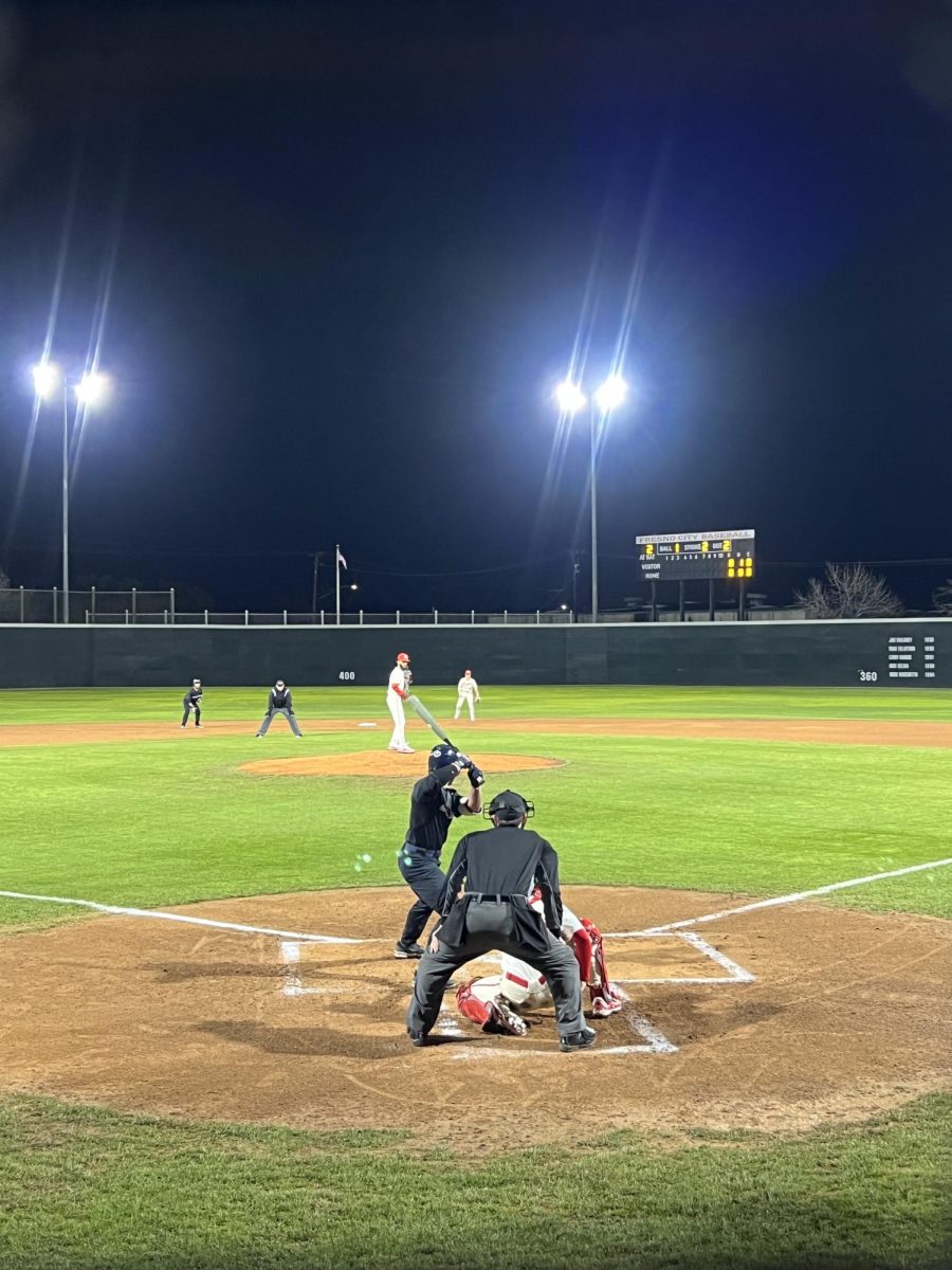 Devon Daniels the pitcher for the Rams in motion to deliver the pitch against the Cosumnes River College Chiefs with two runners on base in the top of the first inning on Feb. 2, 2024.