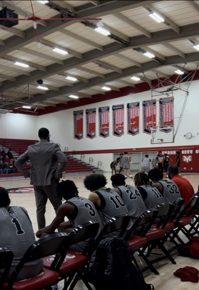 Coach+Robert+Haynes+attentively+looking+out+onto+the+court+Jan.+13%2C+2024+while+his+team+gets+a+free+throw.+The+Rams+won+this+game+against+Porterville+College+Pirates+with+a+score+of+76-67.