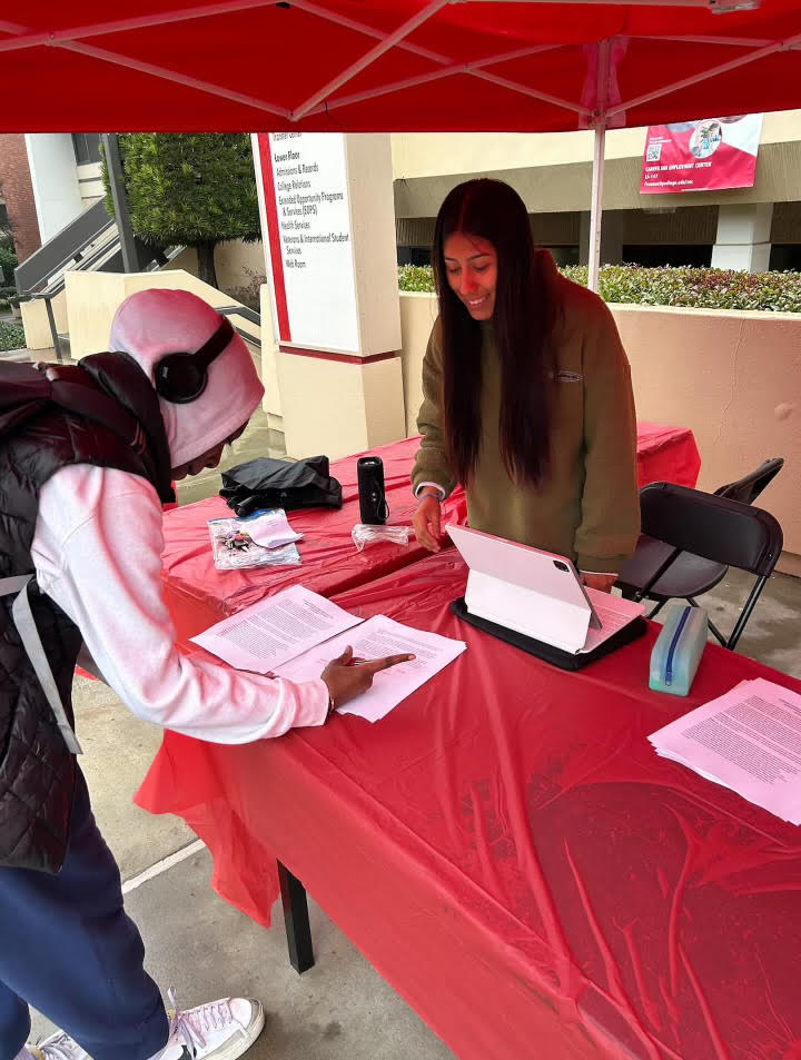 Student athlete advisor committee president Brisa Serna working club rush, recruting new members for the club.