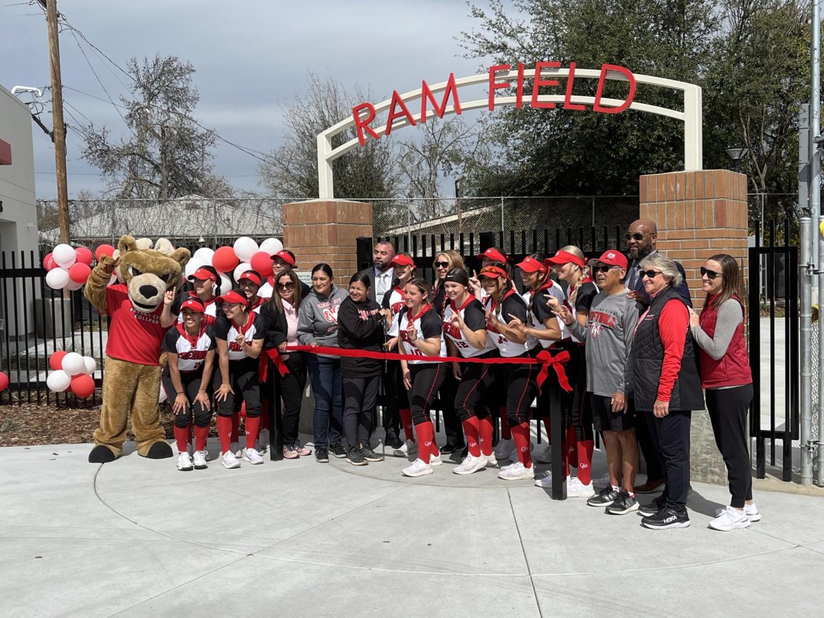 Fresno City College softball and faculty pose for a picture before the ribbon cutting for the new softball complex at FCC on March 5.
