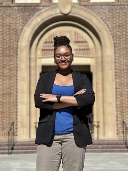 Qiyamah Jackson posing in front of the OAB.