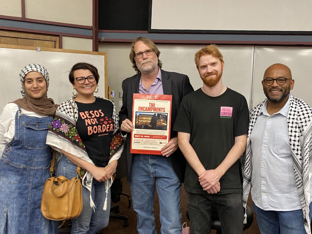 (left to right) Rawan Kiran, Linda Renland, Paul Gilmore, Michael Workman, and Matthew Gillian pose for a picture with a promotional poster for the Fresno City College’s screening of “The Encampments” in the Forum Hall-101 on May 15, 2025.