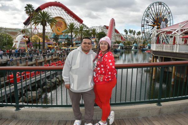 (Left) Joe Maya, Alyssa’s husband, and Alyssa Bustamante pose for a photo in front of Pixar Pier on Dec 2, 2022. Photo contributed by Alyssa Bustamante.