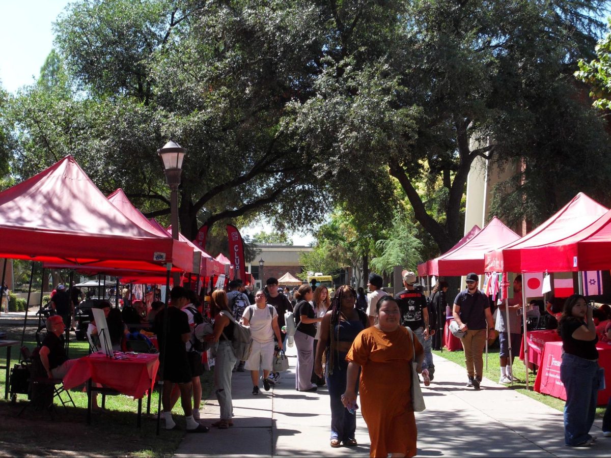 Fresno City College students attending Club Rush and visiting club booths at the college mall on Aug. 27, 2025. 