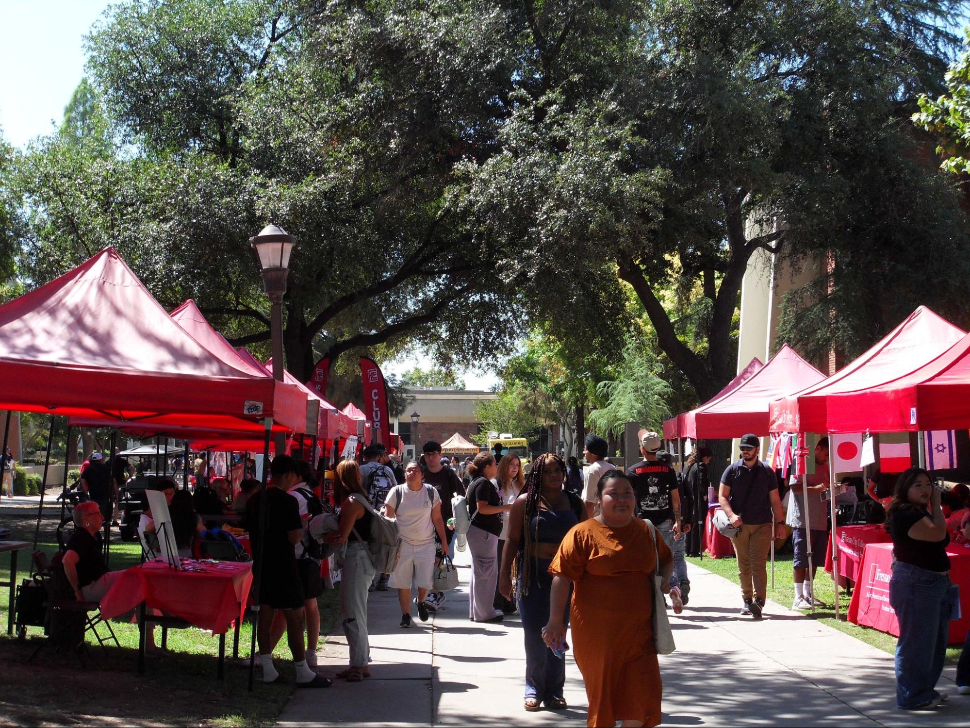Fresno City College students attending Club Rush and visiting club booths at the college mall on Aug. 27, 2025. 