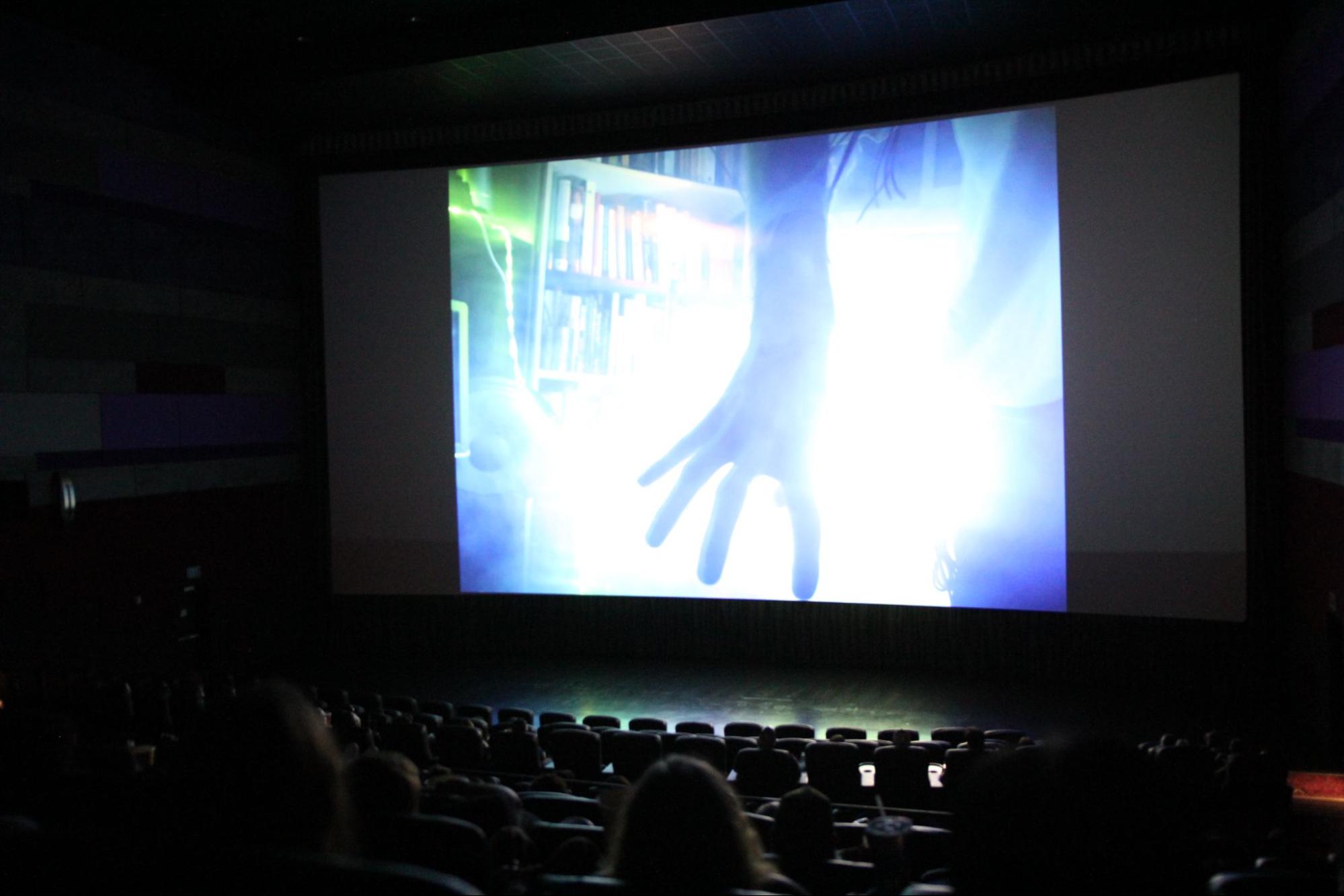 Moviegoers from around the central valley watch a scene from “The Glitch” that is projected onto the largest screen at Maya Cinemas for the CMAC 72 Hour Film Race screening on Aug. 22, 2025. 