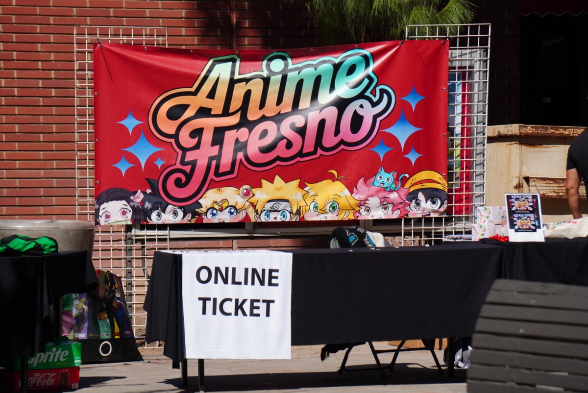 A banner that reads "Anime Fresno" is displayed above a registration table during the Anime Fresno convention at Fresno City College on Sept. 13.