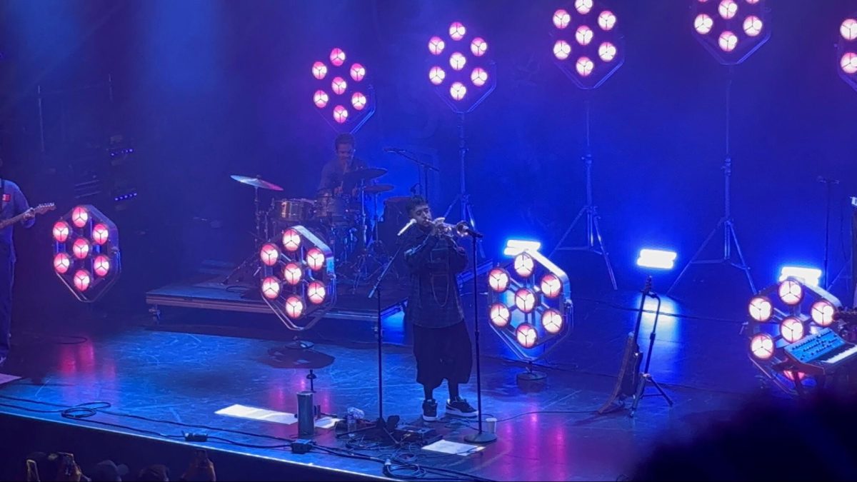 Cuco (center) and the band playing the end of his song “Lo Que Siento” on the trumpet at the Channel 24 venue in Sacramento on Sept. 11. 