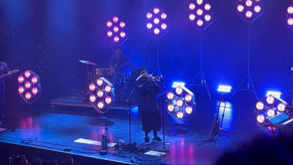 Cuco (center) and the band playing the end of his song “Lo Que Siento” on the trumpet at the Channel 24 venue in Sacramento on Sept. 11. 