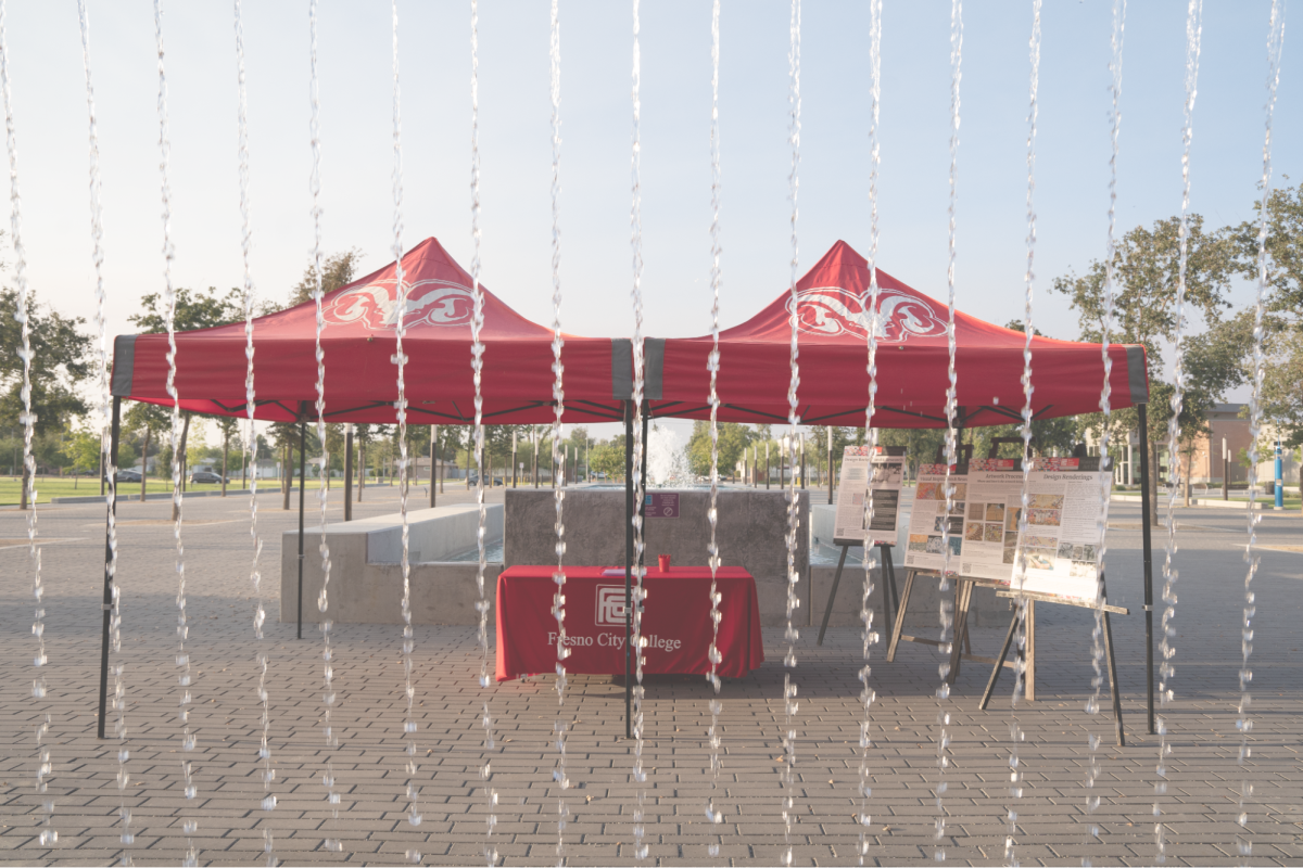 Displays in front of the West Fresno Center water feature describe the process and inspirations for the artworks to be installed, photographed on Sept. 3. 