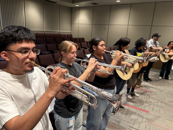 Students in Mariachi (MUS-45-41564) practicing with trumpets. Sep. 3.