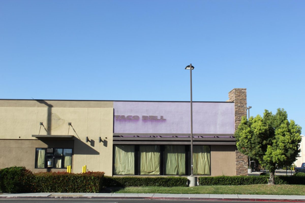 The windows of the N. Blackstone and E. Mckinley Taco Bell are covered since the restaurant closed this semester. Photo taken on Oct. 8.