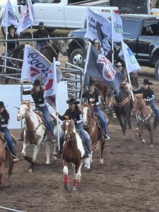 Riders on horseback gallop onto the track during the brand new rodeo that has replaced the live horse racing at The Big Fresno Fair on Oct. 3.