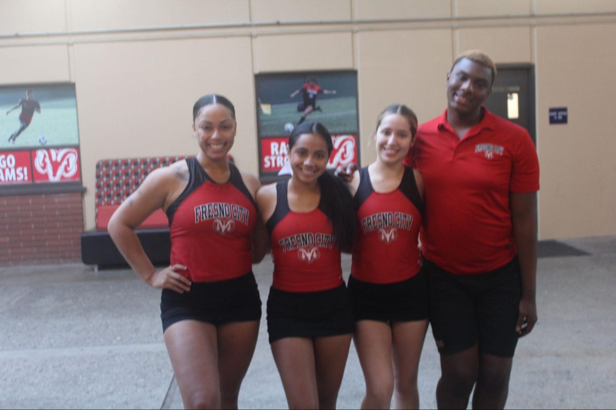 (left to right) Alexis Arafiles, Fabianna Montoya, Chloe Rios and Darell Austin pose in front of gym on Oct. 9.