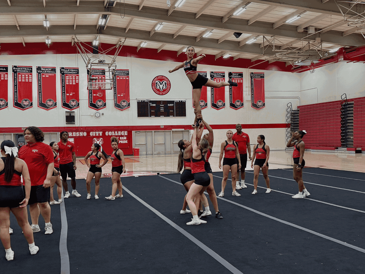 Fresno City College’s cheer/stunt team practicing their skills for competition season in the gym on Oct. 9.