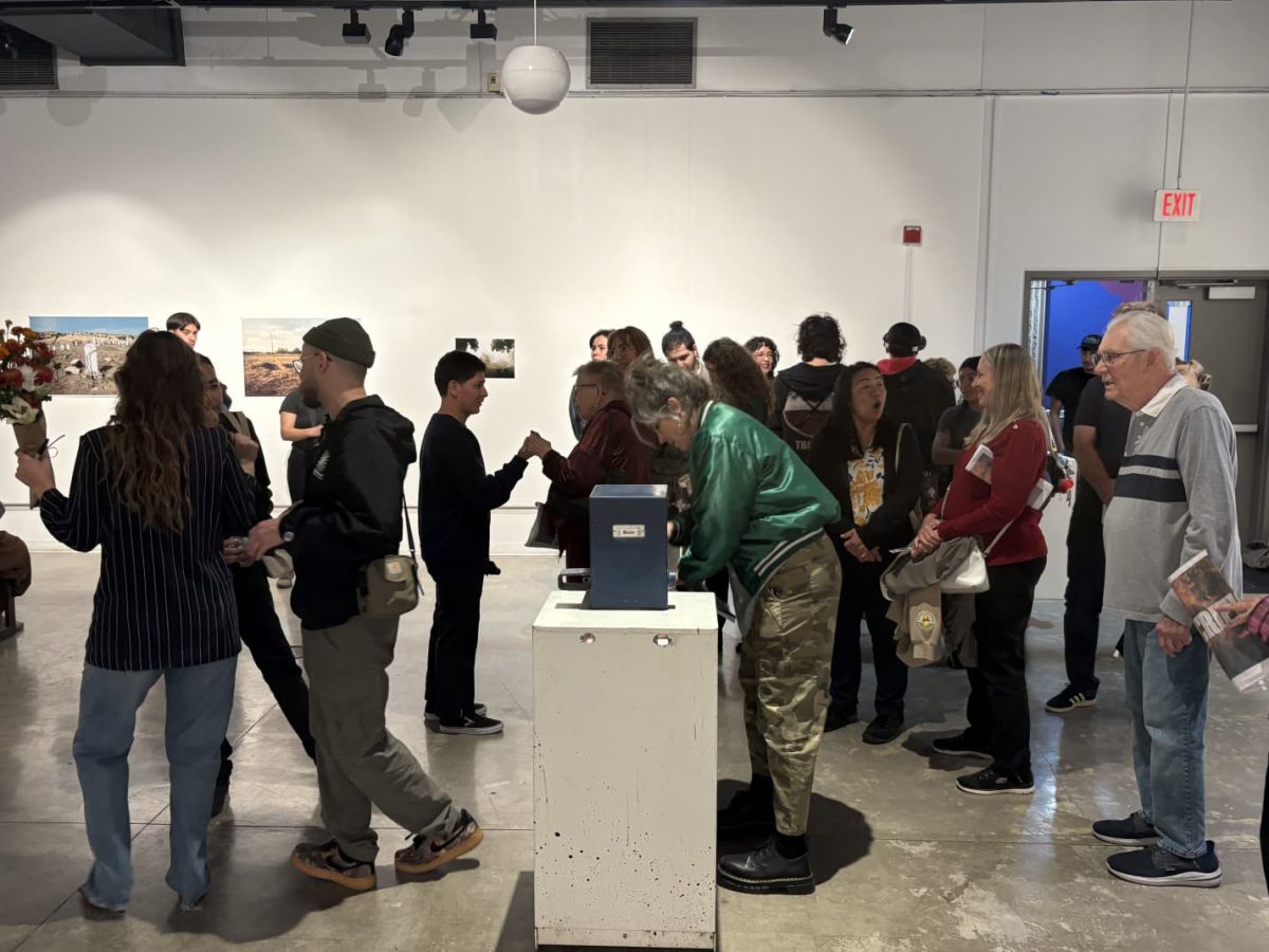 Visitors of Claire Evans’ “Sacrifice Zone” Exhibition Opening on Nov.13.