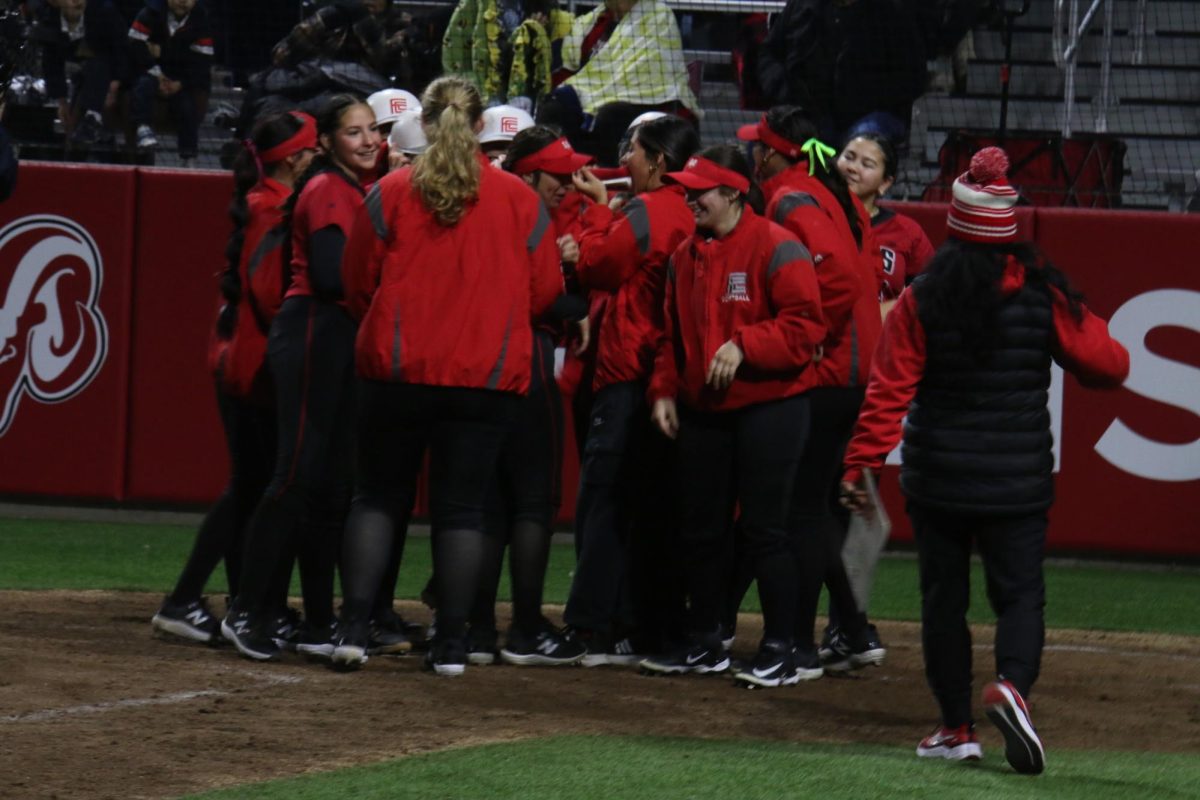 The Rams softball team celebrating win against Bakersfield College at Fresno City College softball field on Jan 23. 
