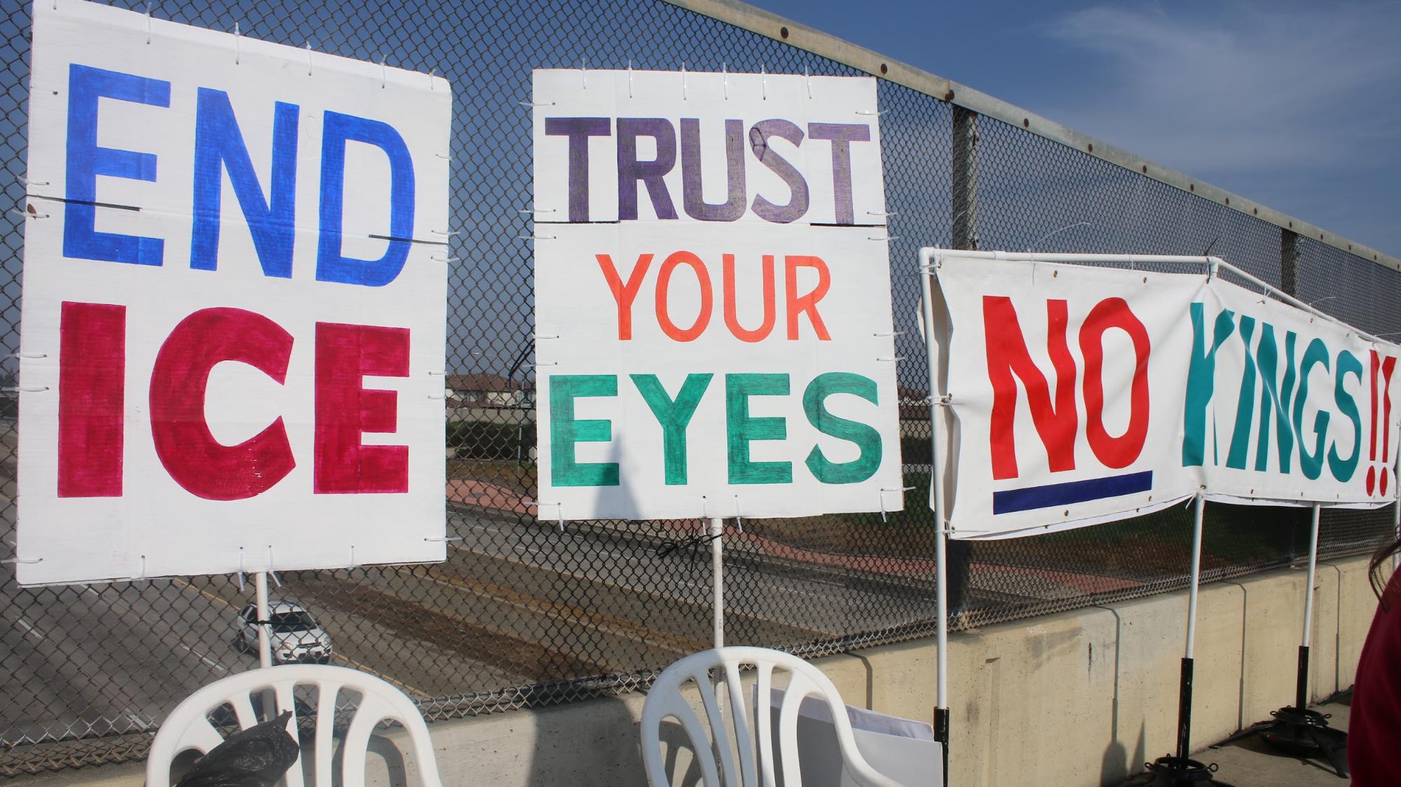 Photo of three signs displayed against the overpass on the Shaw Avenue bridge overpass on Jan. 30. 