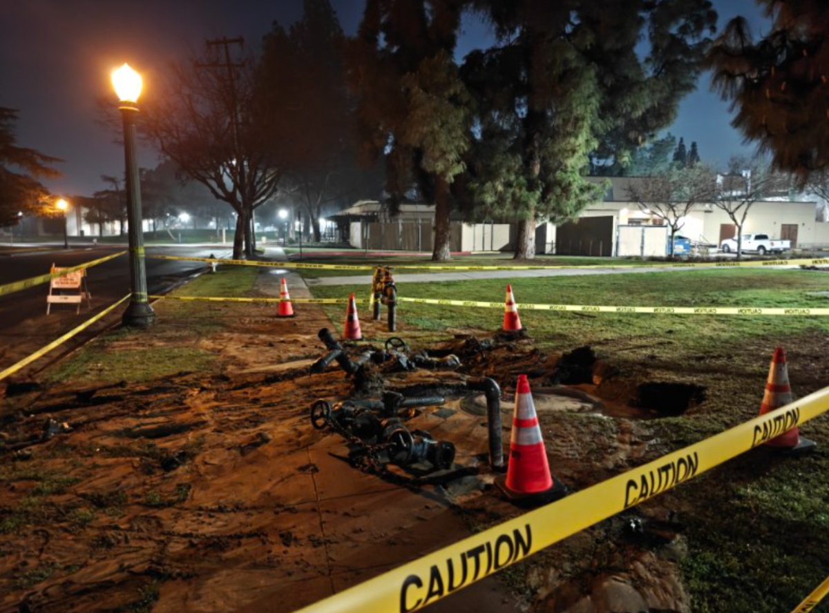 Photo of caution tape and cones surround a damaged water line at Fresno City College campus, on Feb. 2.
