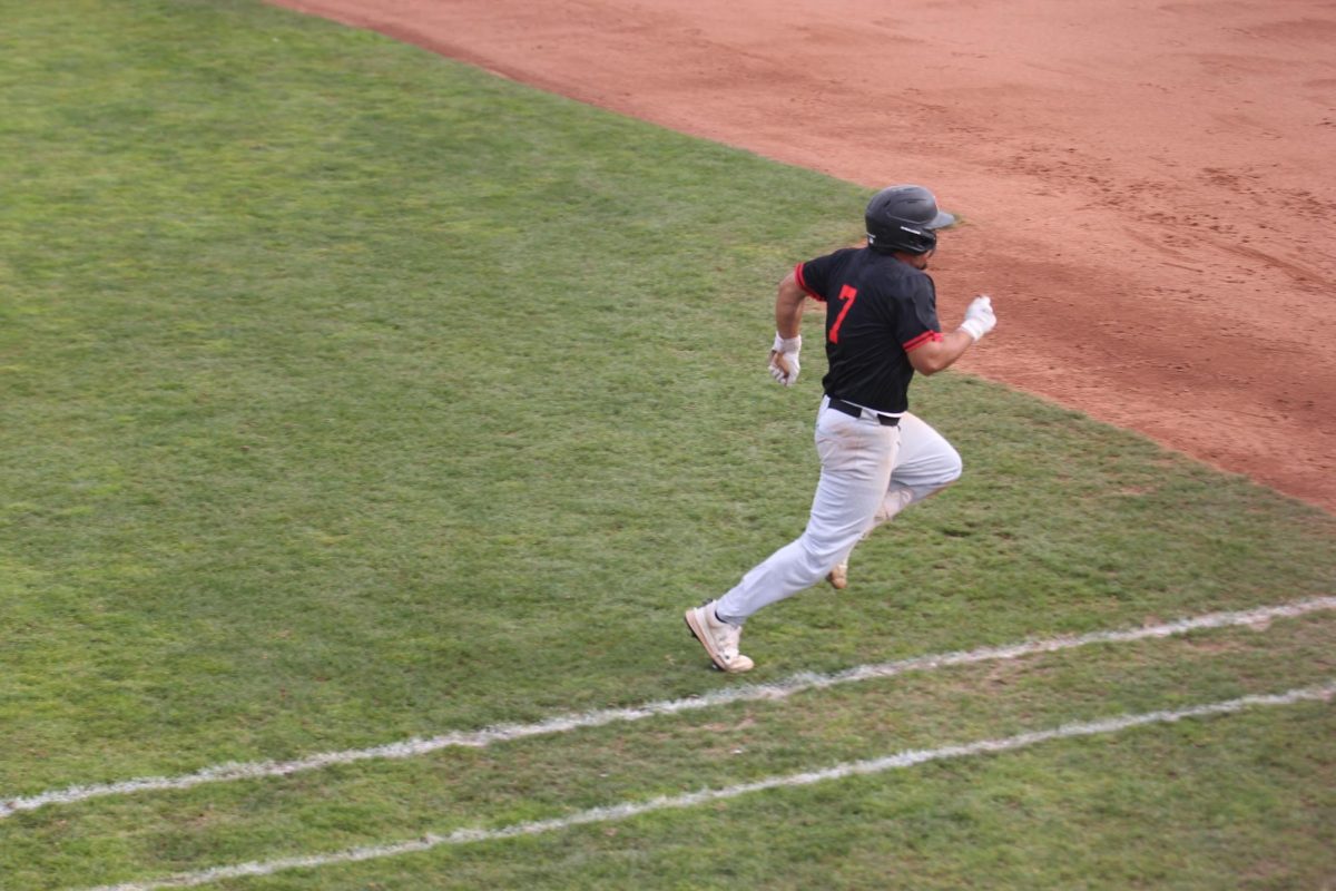 Isac Mandujano no. 7, runs to first base in the game at Union Stadium in Sacramento against Sacramento City College on Feb 14. 