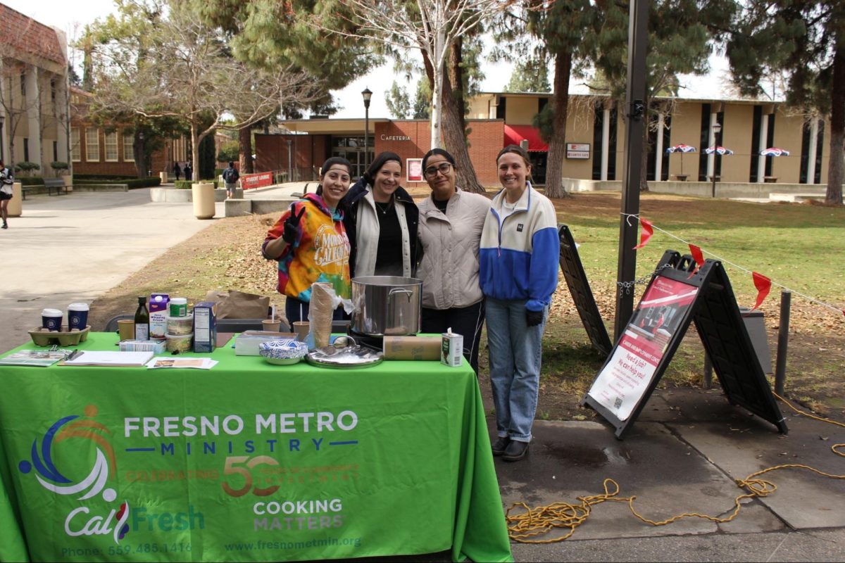 Community members of Fresno Metro Ministry poses for photo after serving free samples and encouraging students to sign up for Cal Fresh benefits at FCC on Feb. 20.(Left to right) Kelsey Tutino, Niamh Schumacher, Jennifer Zaragoza and Arissa Delacerda.