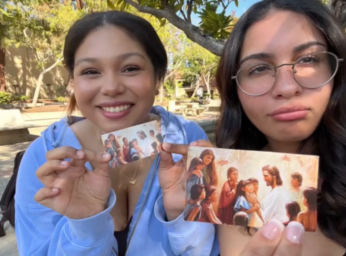 (Left to right) Photo of Rampage reporter Gracie Ward and FCC student Felicity Machicote who majors in marketing, holding missionary cards. Photo sent by Felicity Machicote