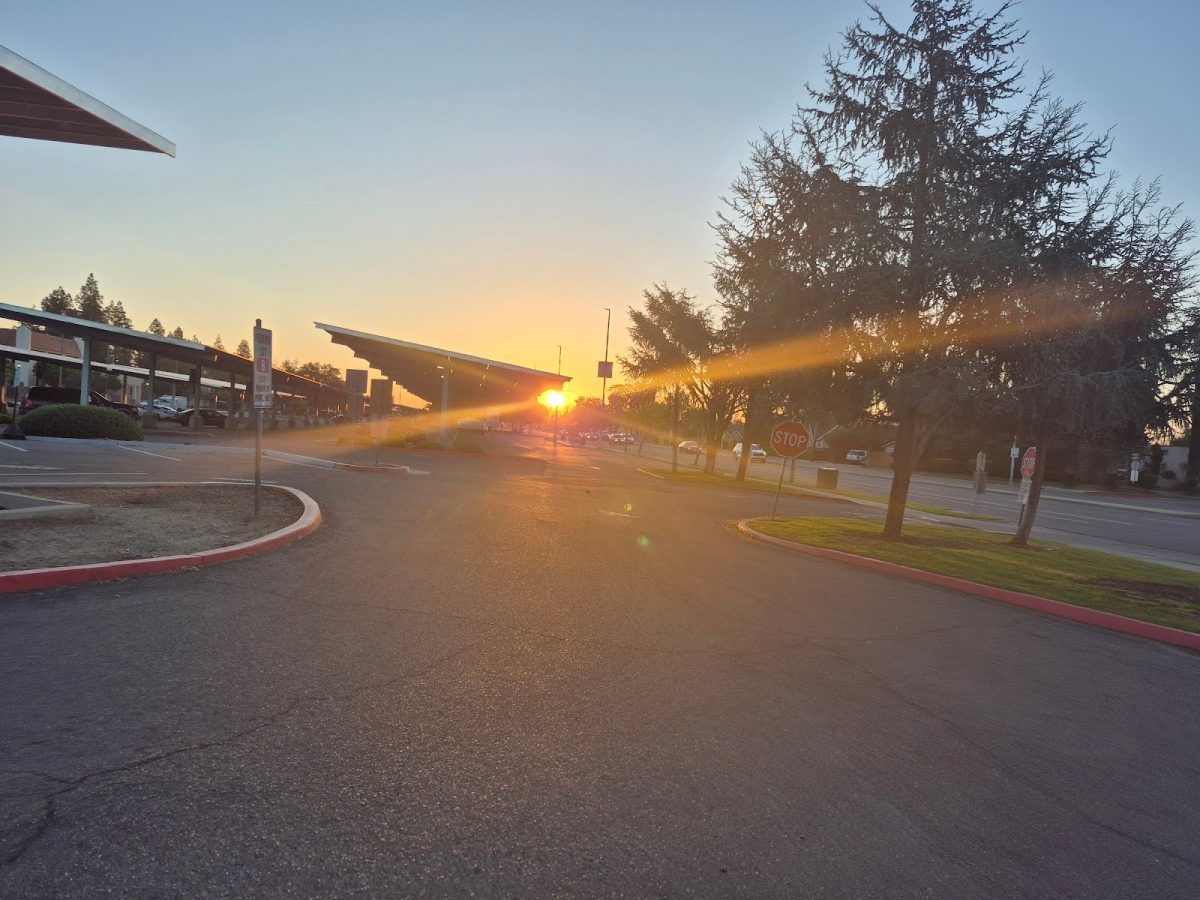 The sun rises over parking lot B at Fresno City College near Van ness and Mckinley avenue on March 11, a few days after the start of Daylight Saving time.