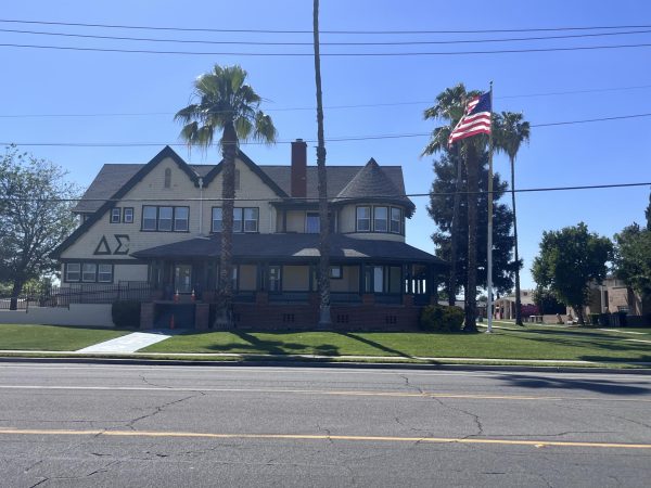 An outside view of Delta Sigma Phi, a fraternity house at Fresno State located on Millbrook near the university lined up with different fraternities. The fraternity houses were different shapes and sizes with security gates and fences to ensure safety for members and nonmembers alike. Photo taken on April 30, 2026