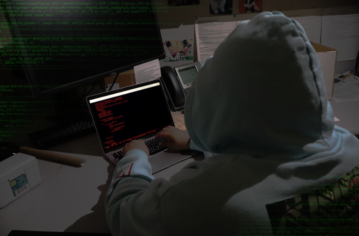 Sports Editor Juan Muratalla posed as a
hacker typing codes into a laptop.